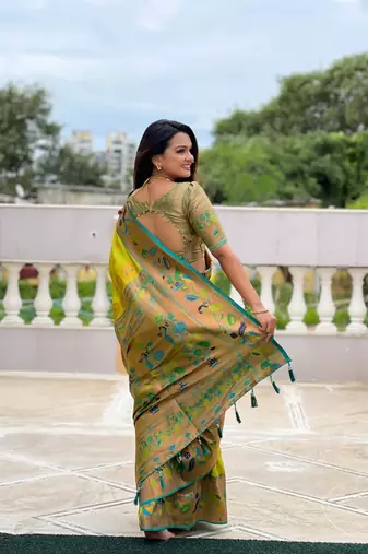 Green elegant art silk woven saree with rich zari border