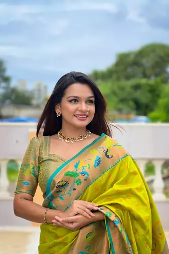 Green elegant art silk woven saree with rich zari border