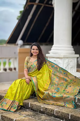 Green elegant art silk woven saree with rich zari border