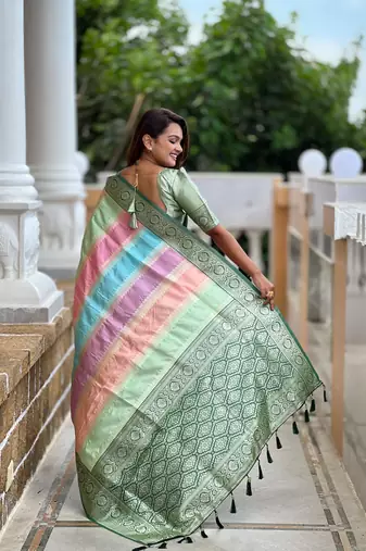 Green elegant art silk woven saree with rich zari border