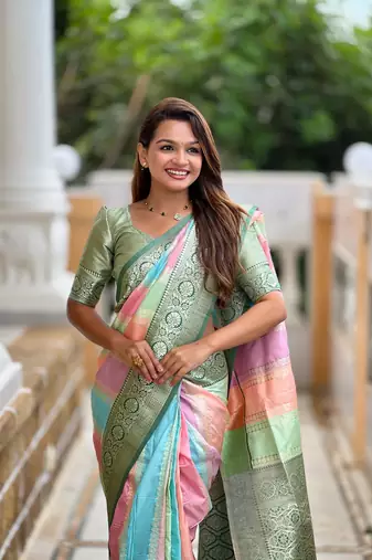 Green elegant art silk woven saree with rich zari border