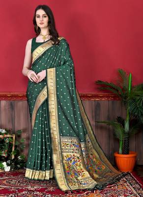 Green elegant art silk woven saree with rich zari border 1
