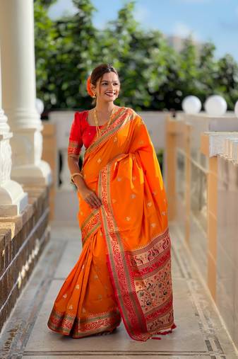 Orange elegant art silk woven saree with rich zari border