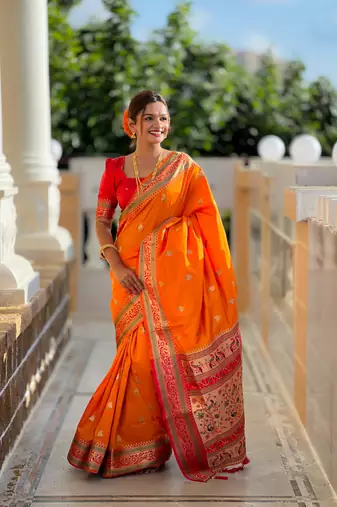 Orange elegant art silk woven saree with rich zari border