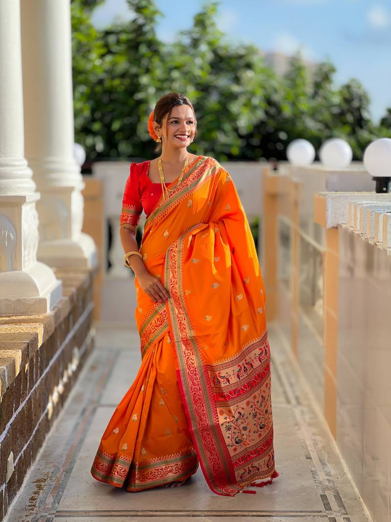 Orange elegant art silk woven saree with rich zari border