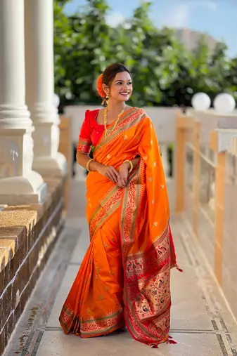 Orange elegant art silk woven saree with rich zari border