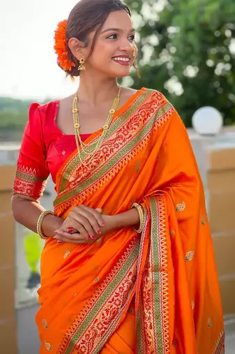 Orange elegant art silk woven saree with rich zari border