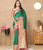Green elegant art silk woven saree with rich zari border