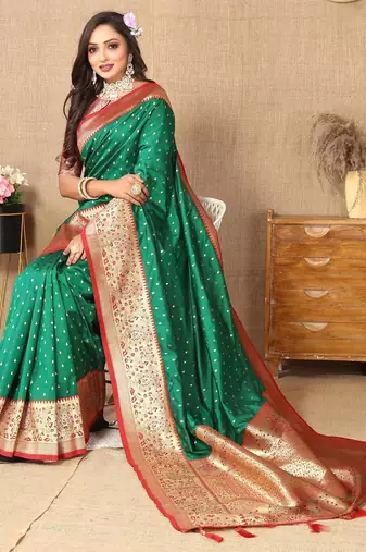 Green elegant art silk woven saree with rich zari border