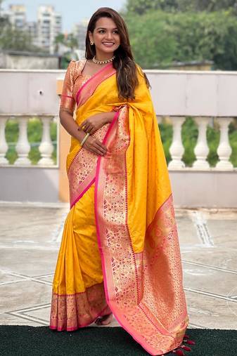 Yellow elegant art silk woven saree with rich zari border