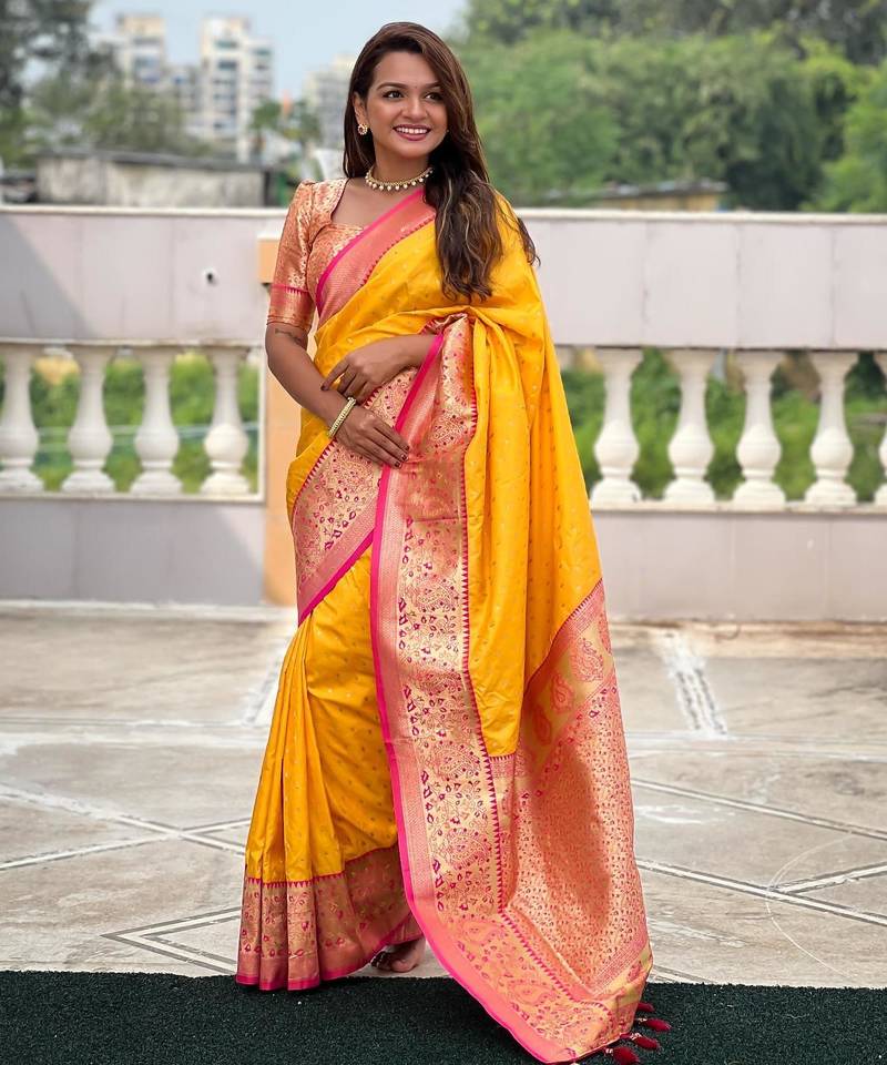 Yellow elegant art silk woven saree with rich zari border
