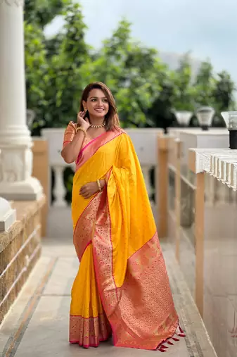 Yellow elegant art silk woven saree with rich zari border