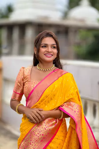Yellow elegant art silk woven saree with rich zari border