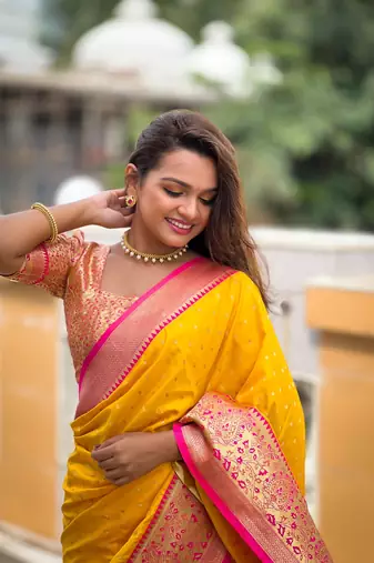 Yellow elegant art silk woven saree with rich zari border