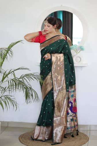 Green elegant art silk woven saree with rich zari border