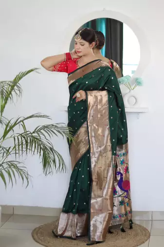 Green elegant art silk woven saree with rich zari border