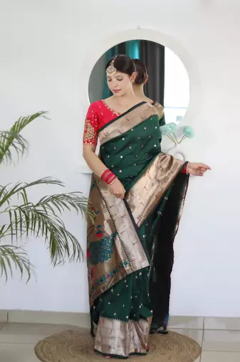 Green elegant art silk woven saree with rich zari border