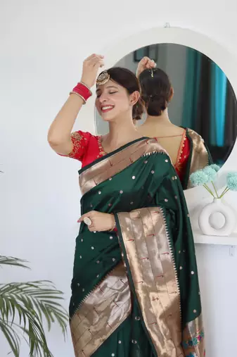 Green elegant art silk woven saree with rich zari border