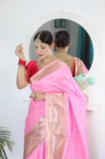 Pink elegant art silk woven saree with rich zari border