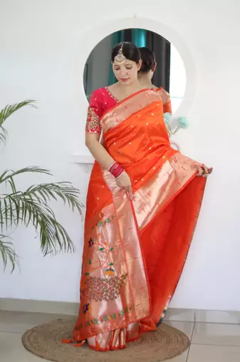Orange elegant art silk woven saree with rich zari border