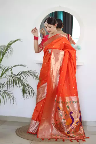 Orange elegant art silk woven saree with rich zari border