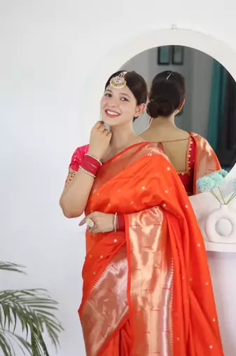 Orange elegant art silk woven saree with rich zari border