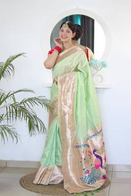 Green elegant art silk woven saree with rich zari border 1