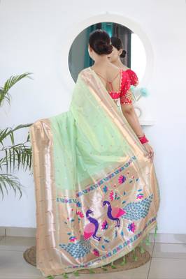 Green elegant art silk woven saree with rich zari border 2