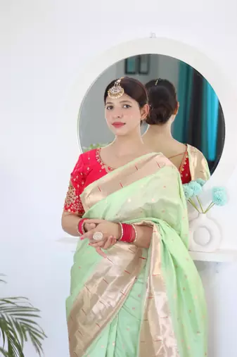 Green elegant art silk woven saree with rich zari border