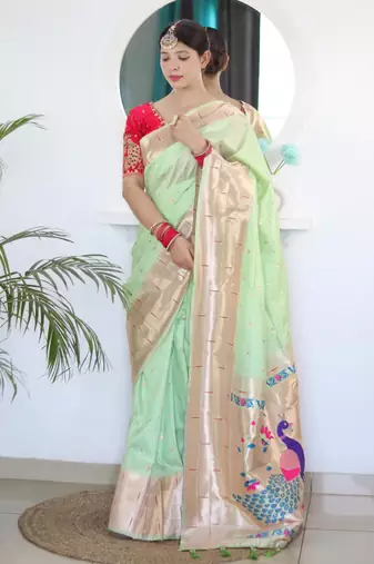 Green elegant art silk woven saree with rich zari border