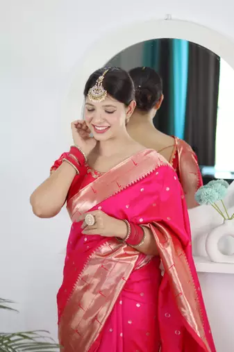 Pink elegant art silk woven saree with rich zari border
