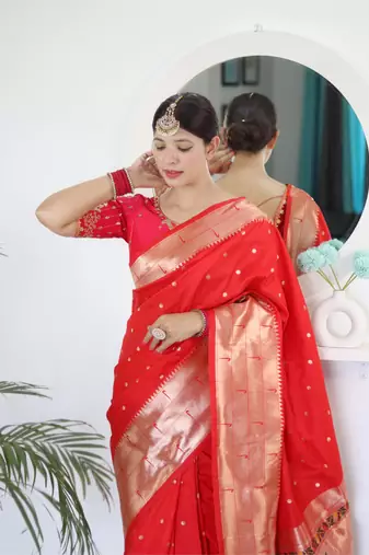 Red elegant art silk woven saree with rich zari border