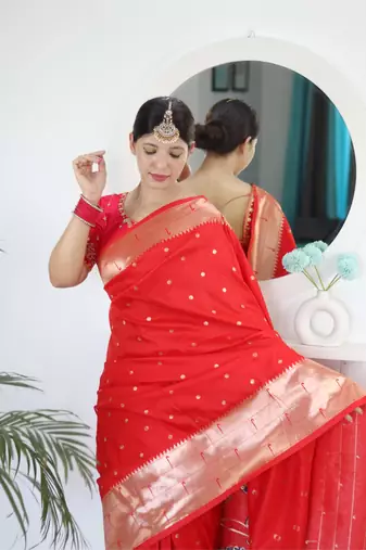 Red elegant art silk woven saree with rich zari border