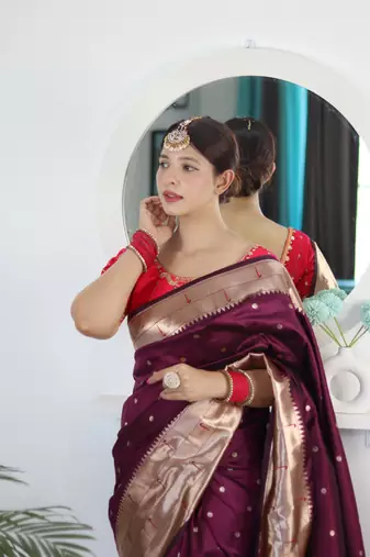 Wine elegant art silk woven saree with rich zari border