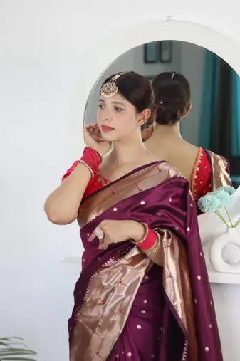 Wine elegant art silk woven saree with rich zari border