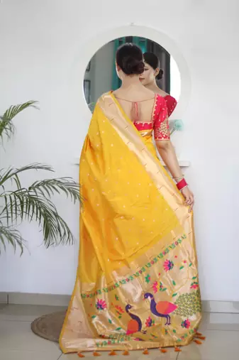 Yellow elegant art silk woven saree with rich zari border
