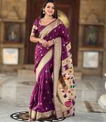Wine elegant art silk woven saree with rich zari border