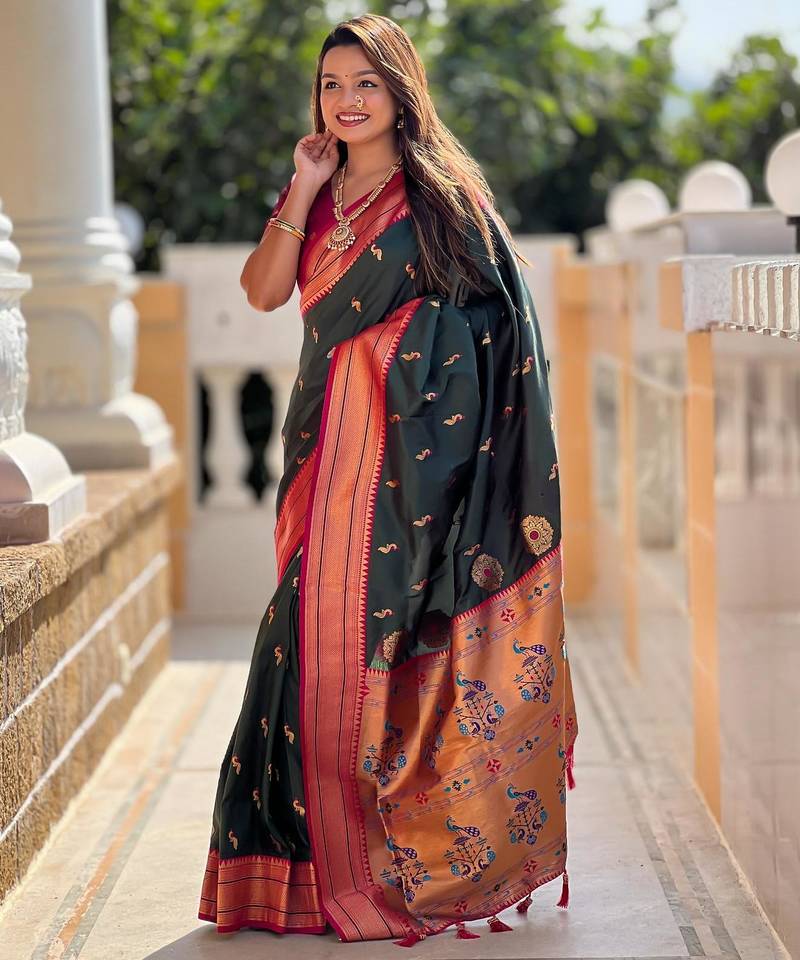 Green elegant art silk woven saree with rich zari border