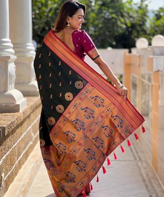 Green elegant art silk woven saree with rich zari border 2