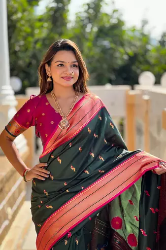 Green elegant art silk woven saree with rich zari border
