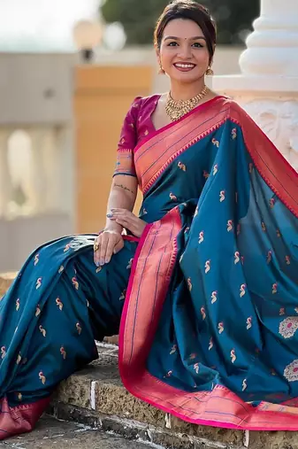 Turquoise elegant art silk woven saree with rich zari border