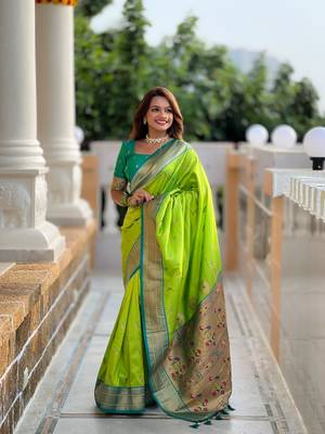 Green elegant art silk woven saree with rich zari border 1