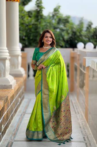 Green elegant art silk woven saree with rich zari border