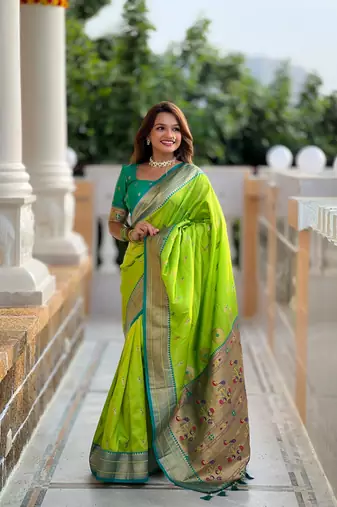 Green elegant art silk woven saree with rich zari border