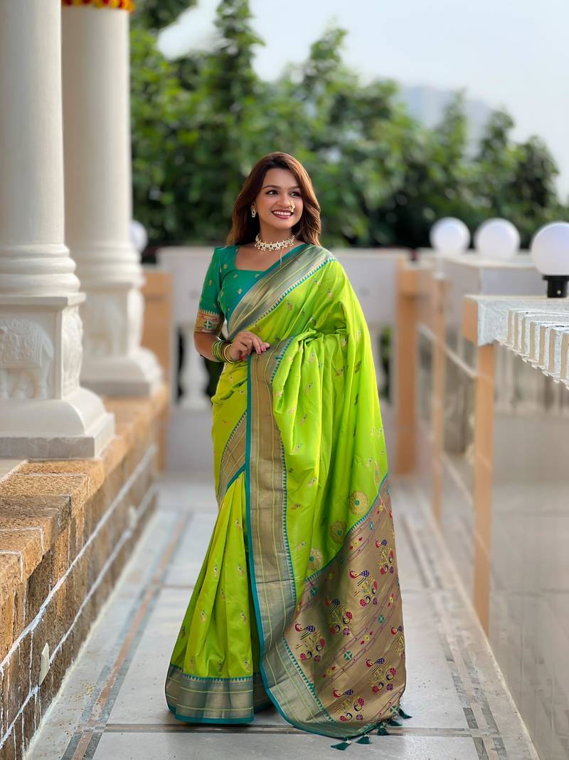 Green elegant art silk woven saree with rich zari border