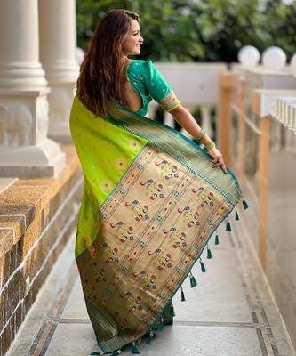 Green elegant art silk woven saree with rich zari border 2