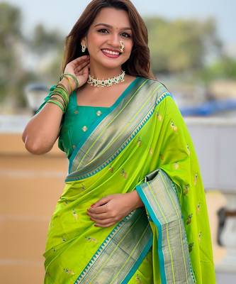 Green elegant art silk woven saree with rich zari border 3