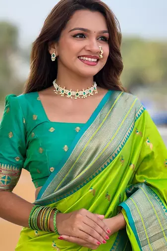 Green elegant art silk woven saree with rich zari border