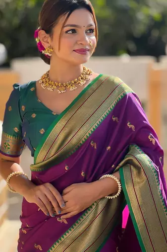 Wine elegant art silk woven saree with rich zari border