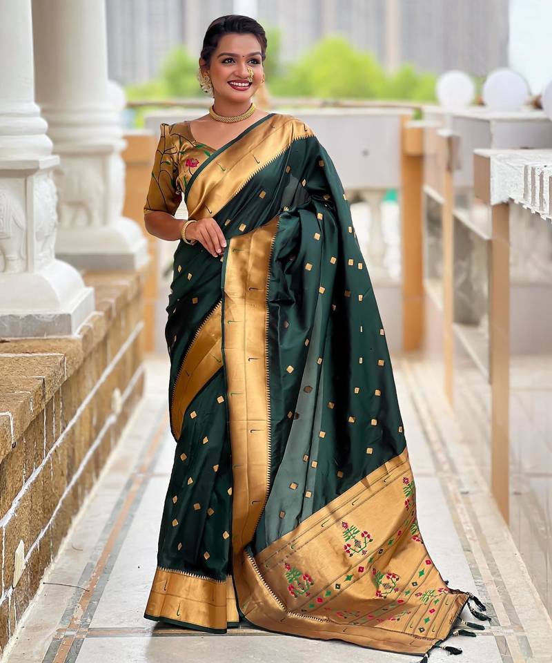 Green elegant art silk woven saree with rich zari border